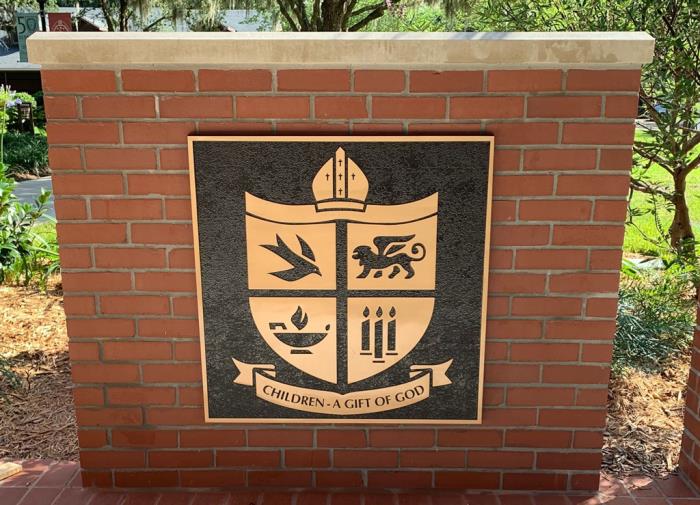 bronze plaques at saint marks episcopal day school shield emblem